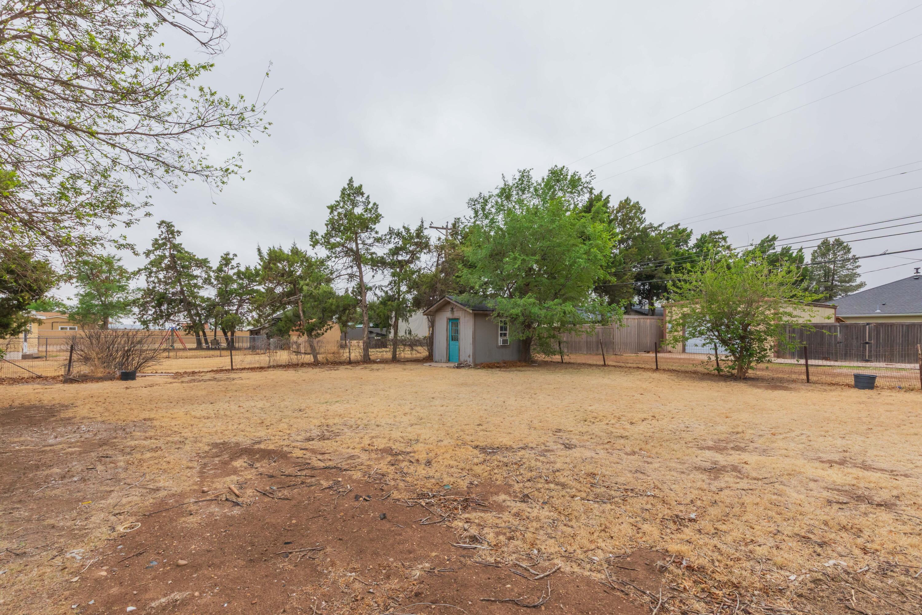 504 High Street Claude, TX 79019 - Photo 38 of 39 a backyard of a house with lots of green space