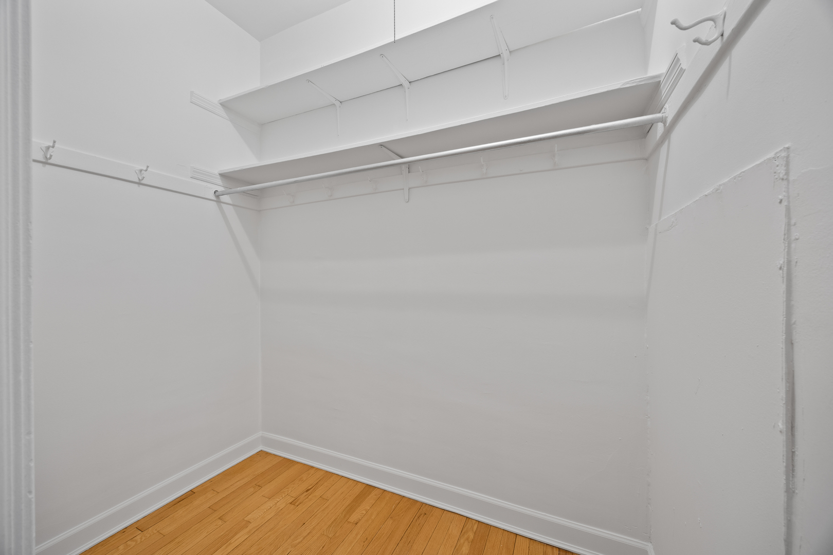 1352 East Madison Park, Unit 2 Chicago, IL 60615 - Photo 11 of 17 a view of a room with wooden floor