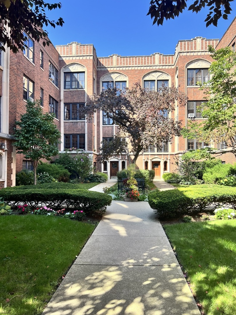 1352 East Madison Park, Unit 2 Chicago, IL 60615 - Photo 2 of 17 a view of a building with a garden
