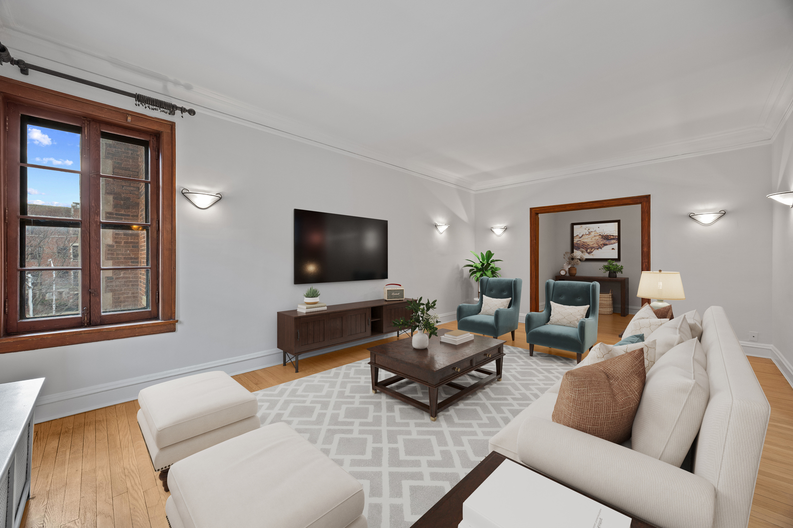 1352 East Madison Park, Unit 2 Chicago, IL 60615 - Photo 5 of 17 a living room with furniture and a flat screen tv