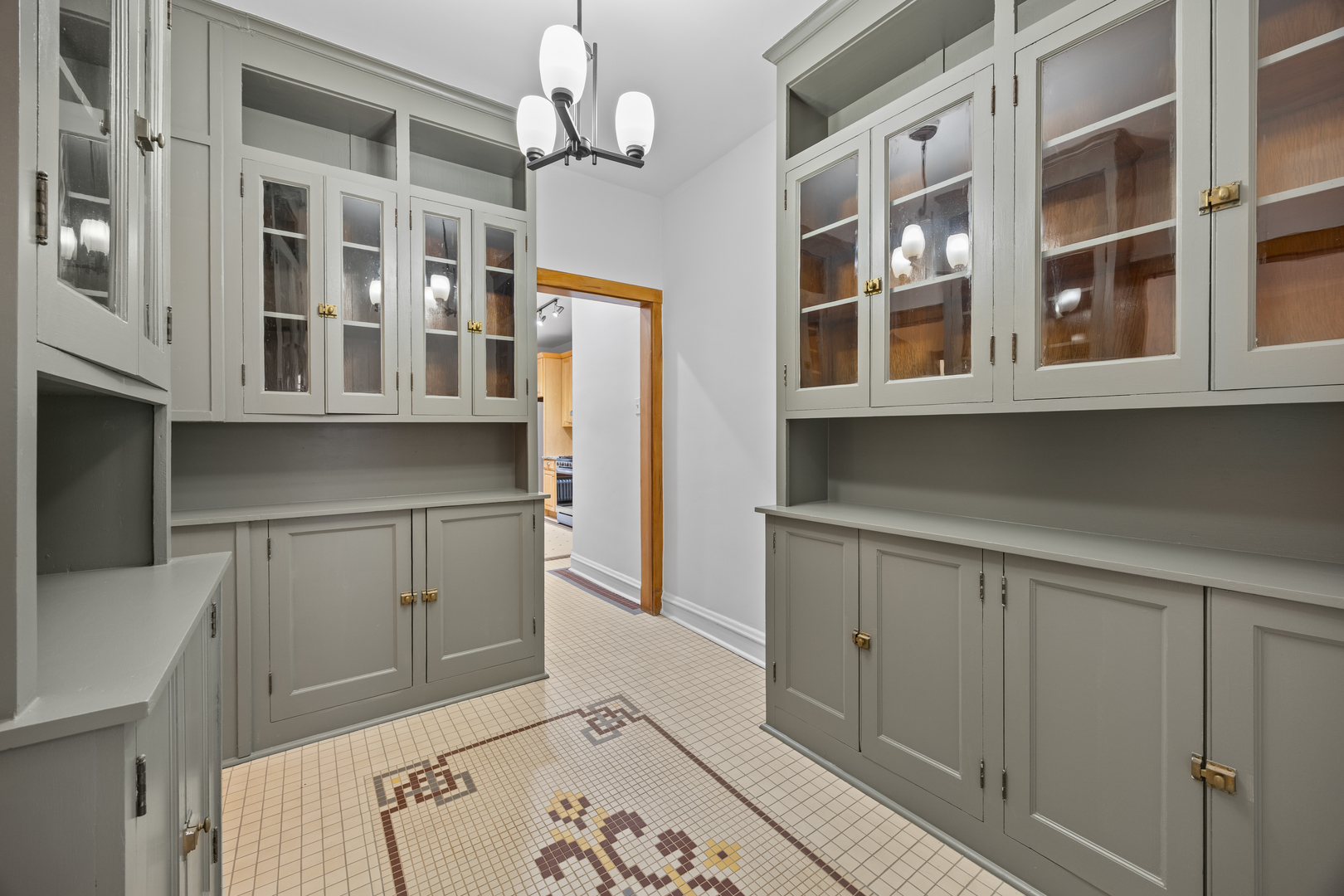 1352 East Madison Park, Unit 2 Chicago, IL 60615 - Photo 7 of 17 a view of cabinets and window