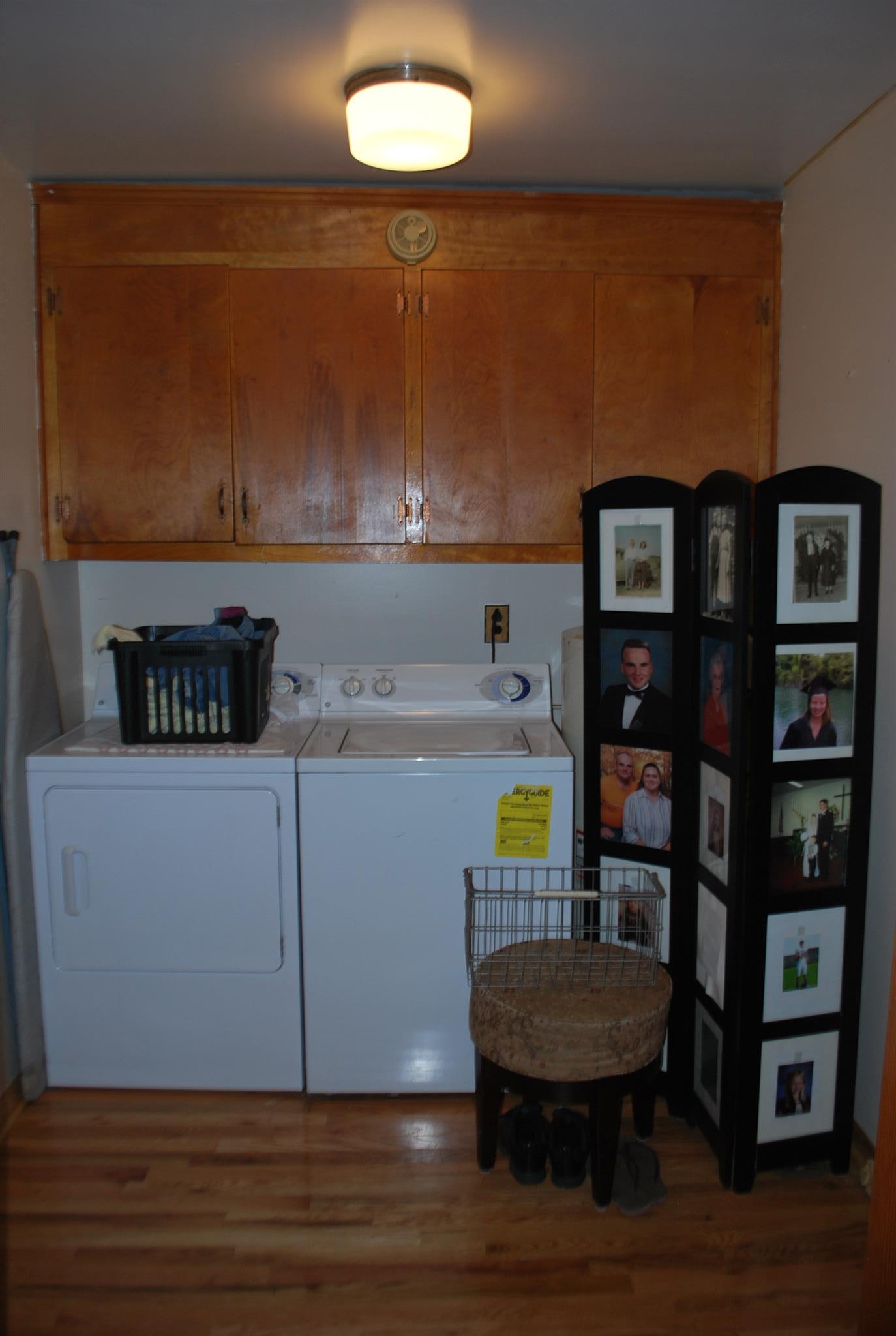 180 Sam Hollow Road Dickson, TN 37055 - Photo 11 of 18 a room with a book shelf and a wooden floor