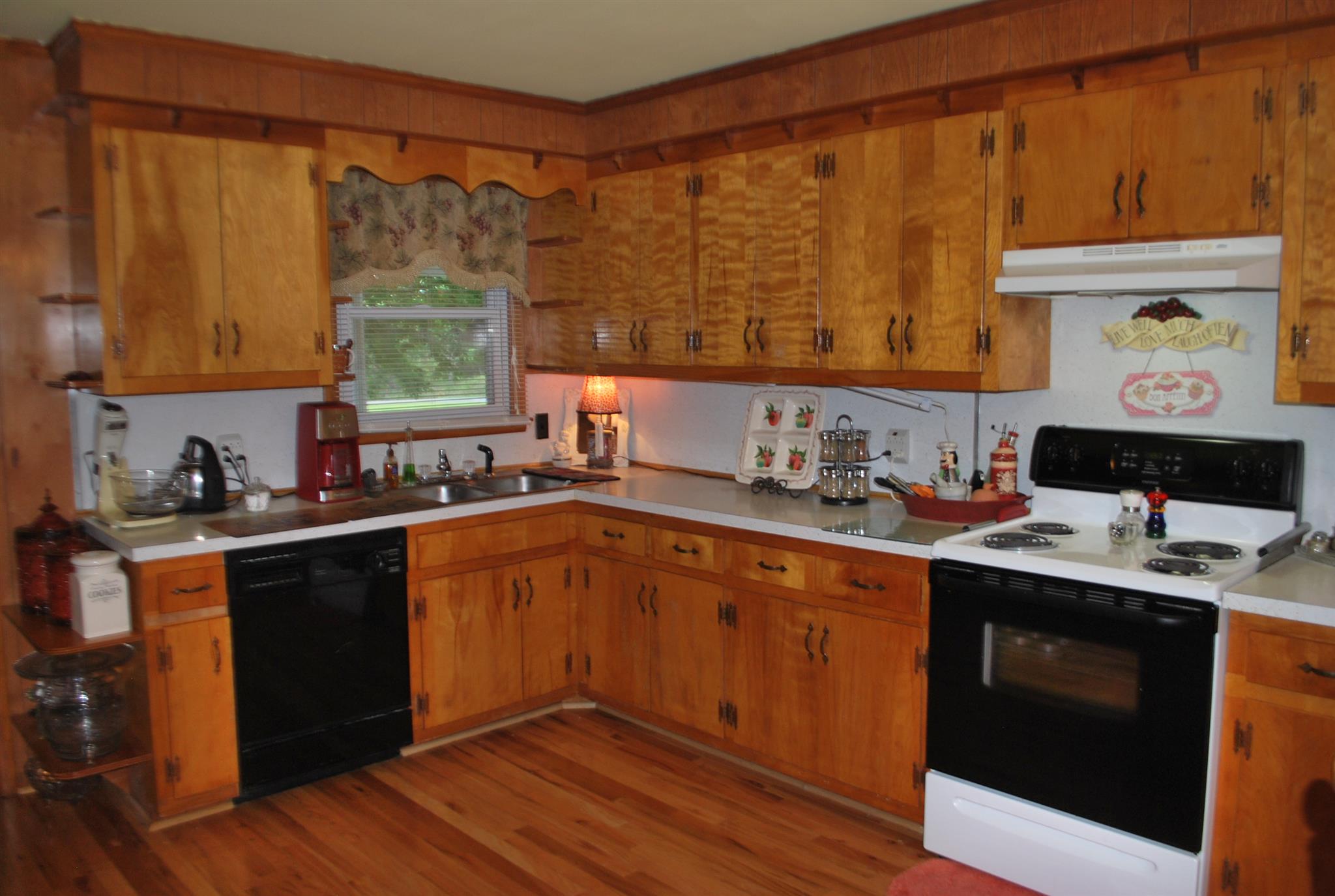 180 Sam Hollow Road Dickson, TN 37055 - Photo 3 of 18 a kitchen with a sink stove and cabinets