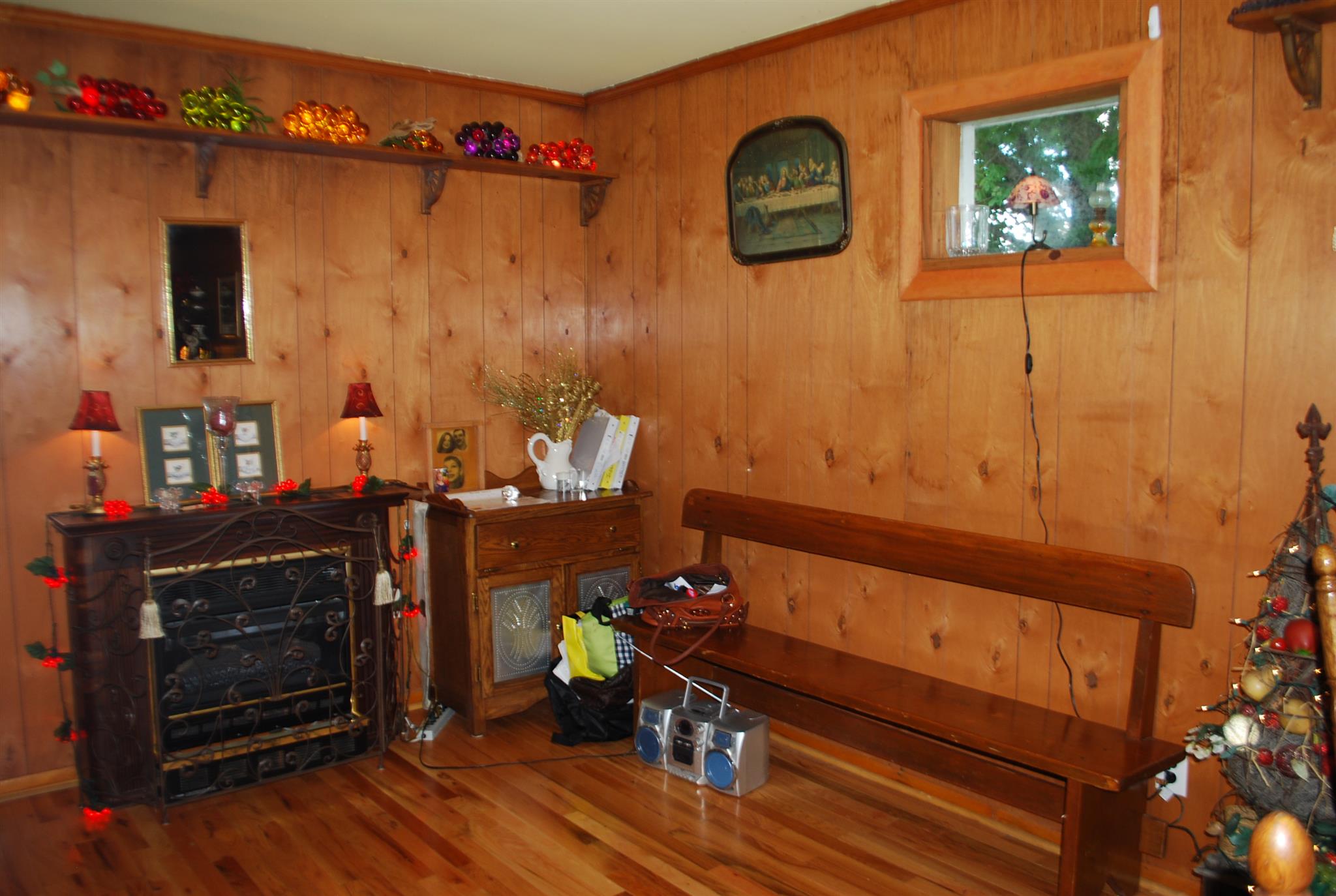 180 Sam Hollow Road Dickson, TN 37055 - Photo 5 of 18 a room with wooden floor and a fireplace