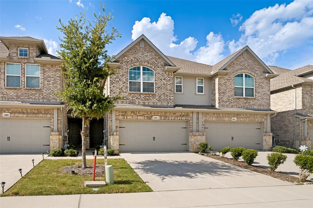 1006 Emil Place Allen, TX 75013 - Photo 2 of 28 Brick and stone facade townhome with arched window accents