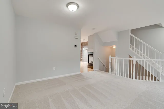 a large kitchen with kitchen island a sink stainless steel appliances and cabinets