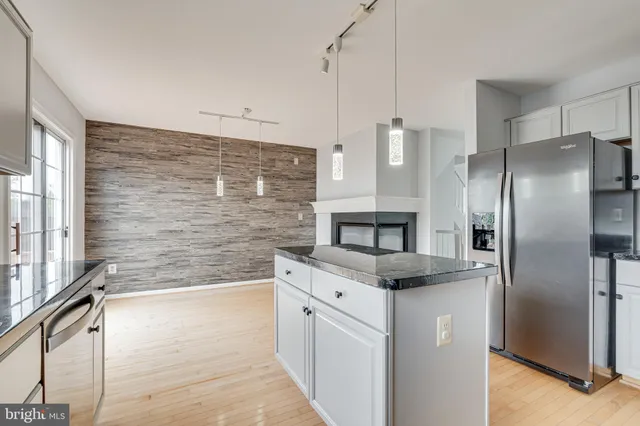 a view of empty room with a fireplace