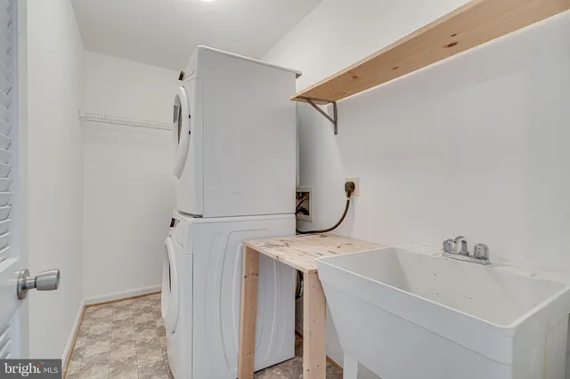 a bathroom with a sink and shower