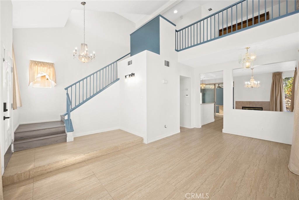 7190 Trivento Place Rancho Cucamonga, CA 91701 - Photo 2 of 13 a view of entryway and hall with wooden floor
