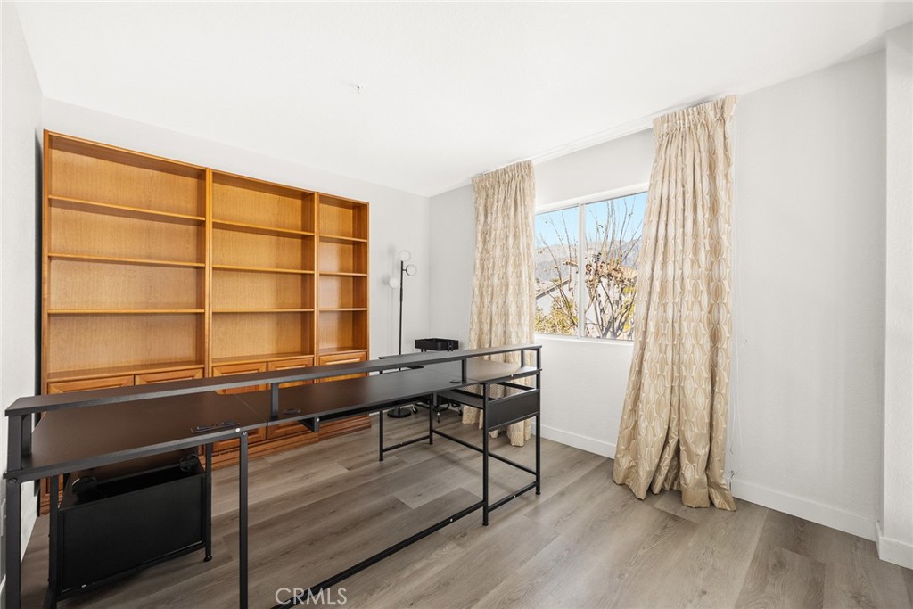7190 Trivento Place Rancho Cucamonga, CA 91701 - Photo 9 of 13 a view of a livingroom with furniture and wooden floor