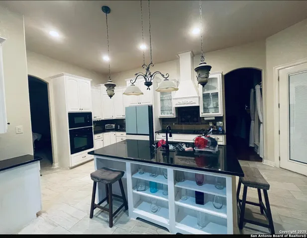 a view of kitchen and dining room with furniture