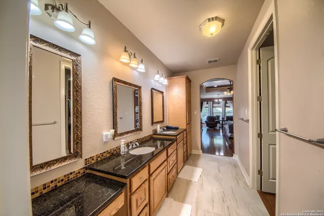 a kitchen with stainless steel appliances a stove and a refrigerator