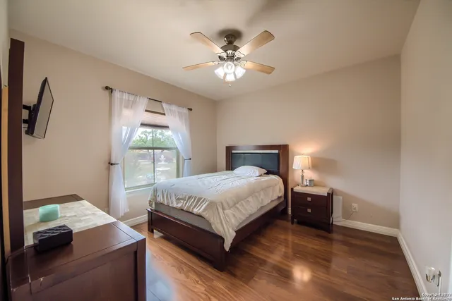 a bedroom with a bed and window