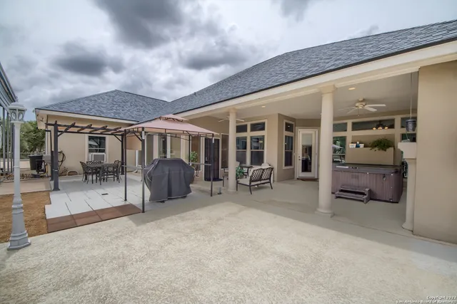 an outdoor space with balcony and furniture