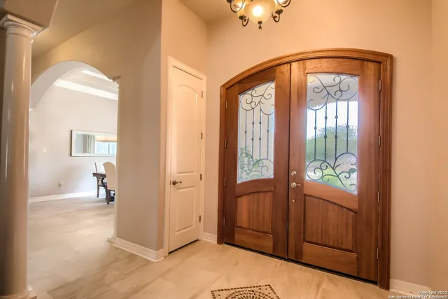 a view of an entryway with wooden floor