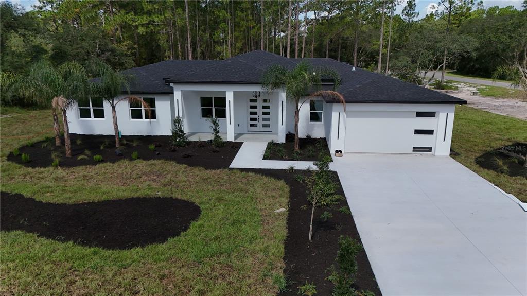 40327 Royal Trails Road Eustis, FL 32736 - Photo 1 of 1 a front view of a house with a yard