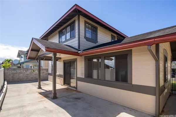 a front view of a house with glass doors