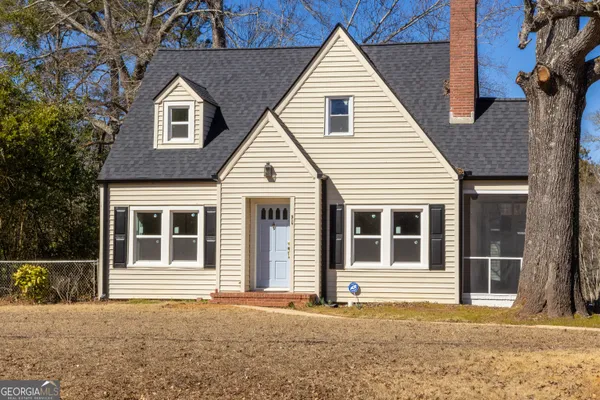 front view of house with a swimming pool