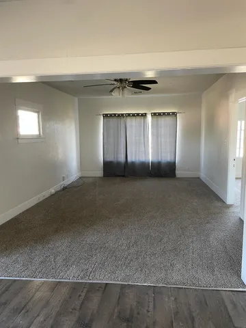 en empty room with windows and closet