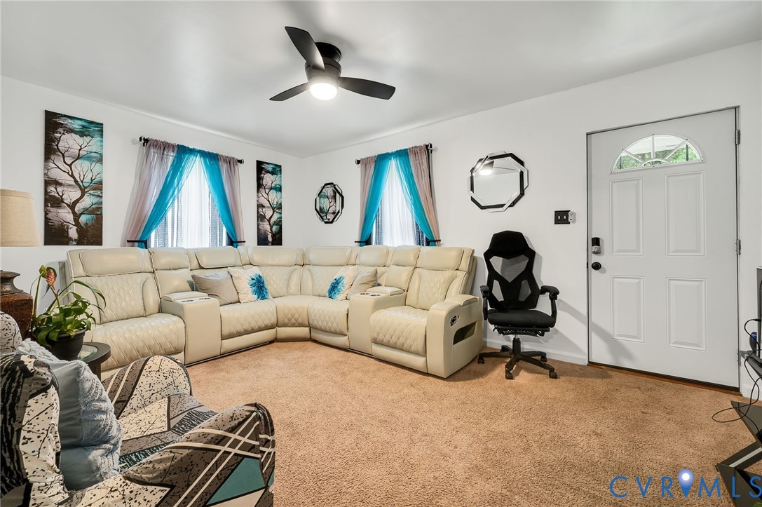 2909 Springview Drive Richmond, VA 23234 - Photo 8 of 19 a living room with furniture and a painting on the wall