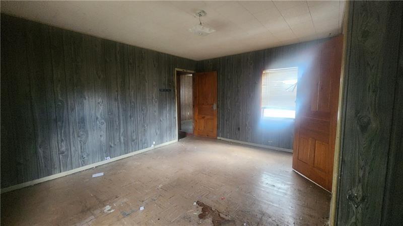 140 High Street Avonmore, PA 15618 - Photo 12 of 19 a view of empty room with wooden floor and fan