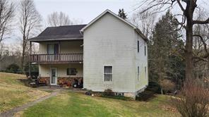 140 High Street Avonmore, PA 15618 - Photo 3 of 19 a view of a house with yard and sitting area