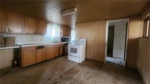 140 High Street Avonmore, PA 15618 - Photo 8 of 19 a kitchen with cabinets a sink and a stove