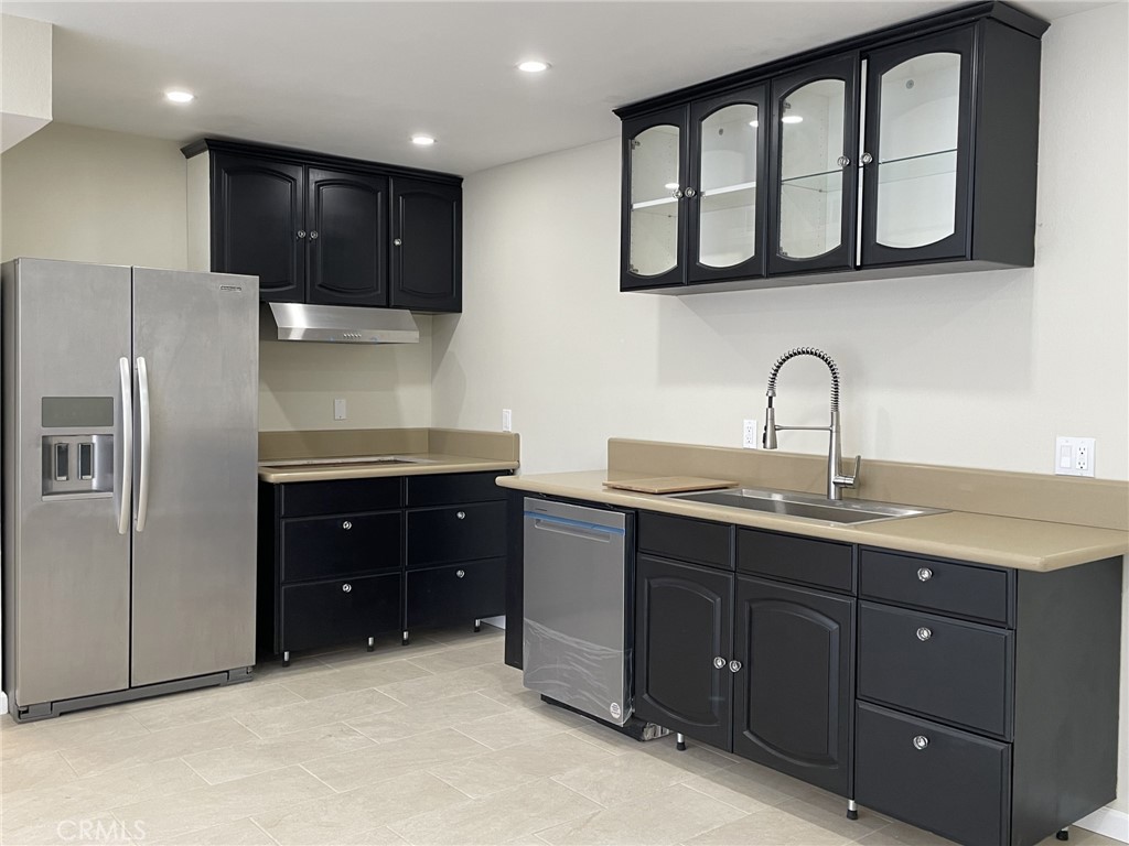 5700 Etiwanda Avenue, Unit 240 Los Angeles, CA 91356 - Photo 1 of 39 a kitchen with stainless steel appliances granite countertop a refrigerator and a sink