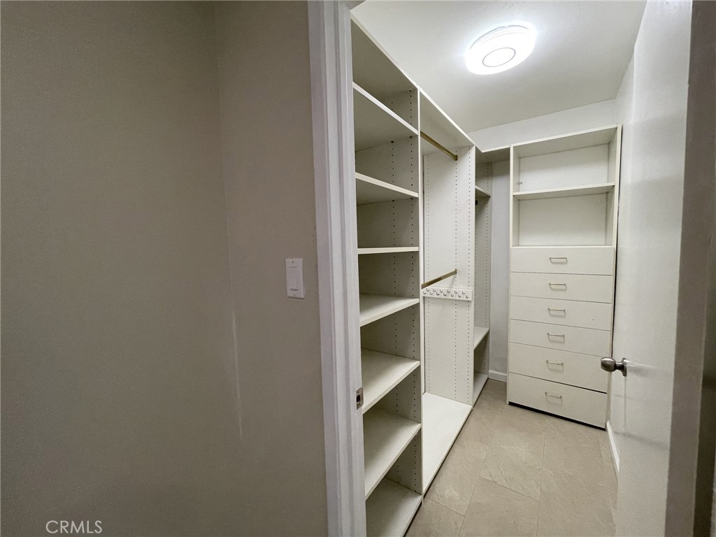 5700 Etiwanda Avenue, Unit 240 Los Angeles, CA 91356 - Photo 23 of 39 a view of walk in closet with empty racks