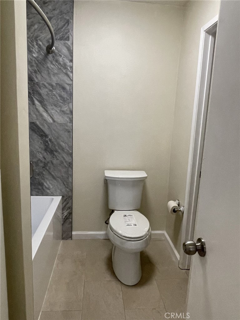 5700 Etiwanda Avenue, Unit 240 Los Angeles, CA 91356 - Photo 27 of 39 a white toilet sitting next to a shower