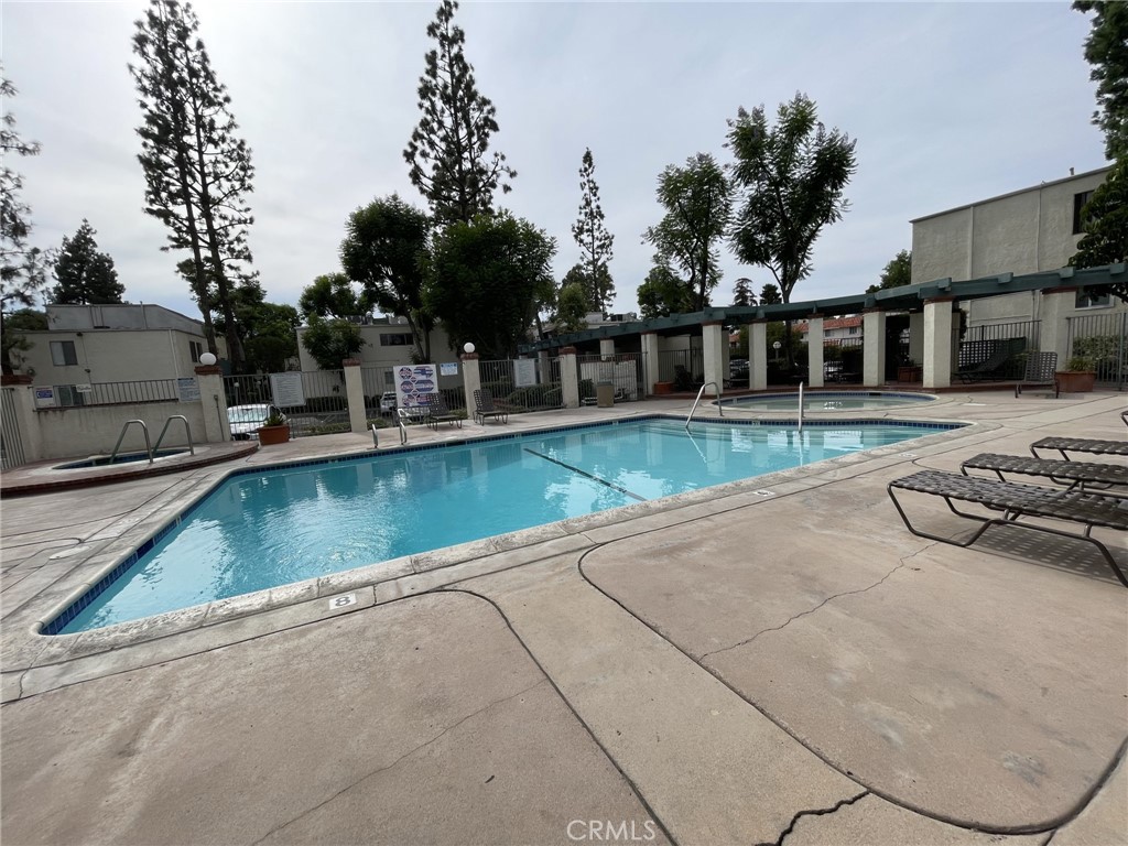 5700 Etiwanda Avenue, Unit 240 Los Angeles, CA 91356 - Photo 36 of 39 a view of a house with pool and sitting area