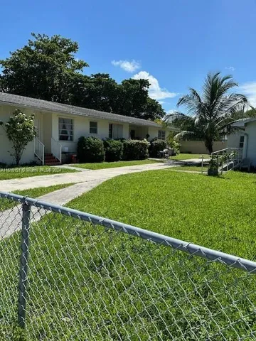 a house view with a garden space