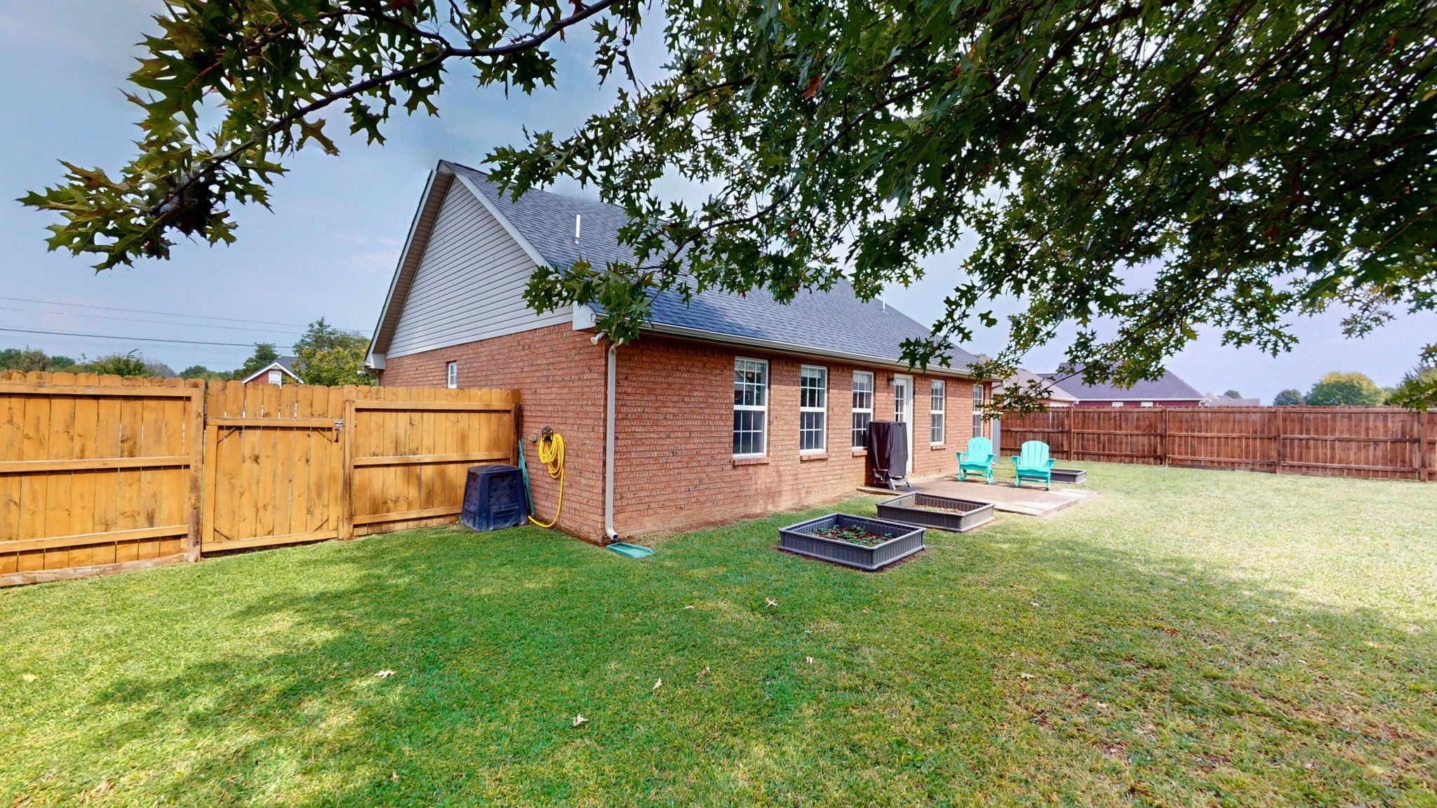 2822 Ridgewood Drive Christiana, TN 37037 - Photo 25 of 39 a backyard of a house with table and chairs