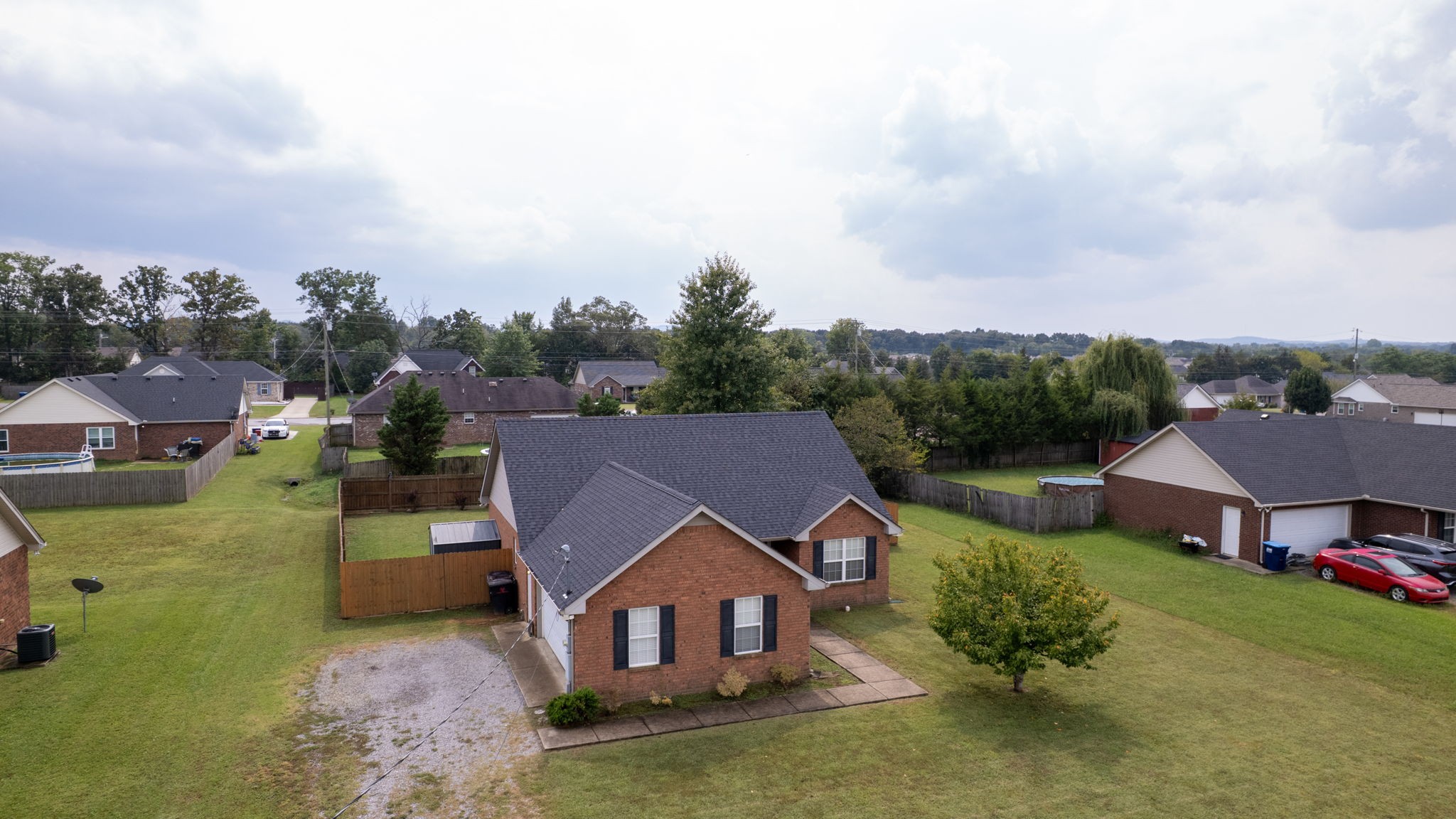 2822 Ridgewood Drive Christiana, TN 37037 - Photo 35 of 39 an aerial view of a house with swimming pool and mountains in the background