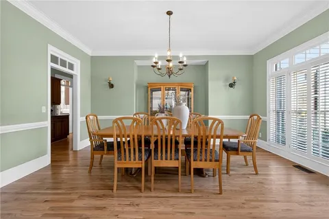 a living room with furniture a fireplace and a table