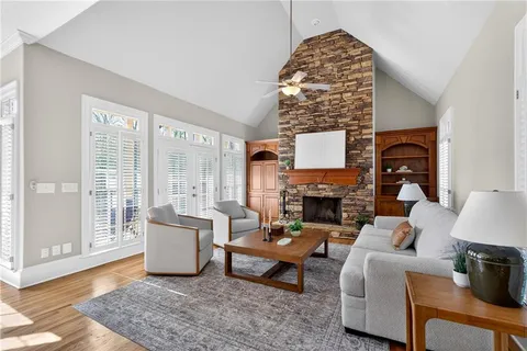 a kitchen with granite countertop wooden cabinets and stainless steel appliances