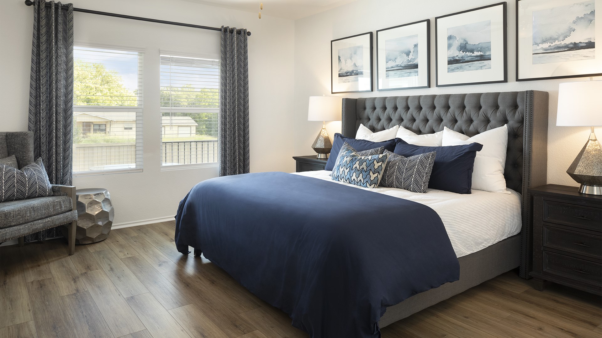 18001 Prairie Falcon Way Pflugerville, TX 78660 - Photo 9 of 18 a bedroom with a bed and wooden floor