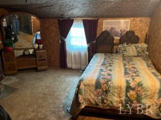6301 Straightstone Road Long Island, VA 24569 - Photo 11 of 17 a bed sitting in a room next to a window