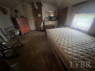 6301 Straightstone Road Long Island, VA 24569 - Photo 10 of 17 a bedroom with a bed and a table in it