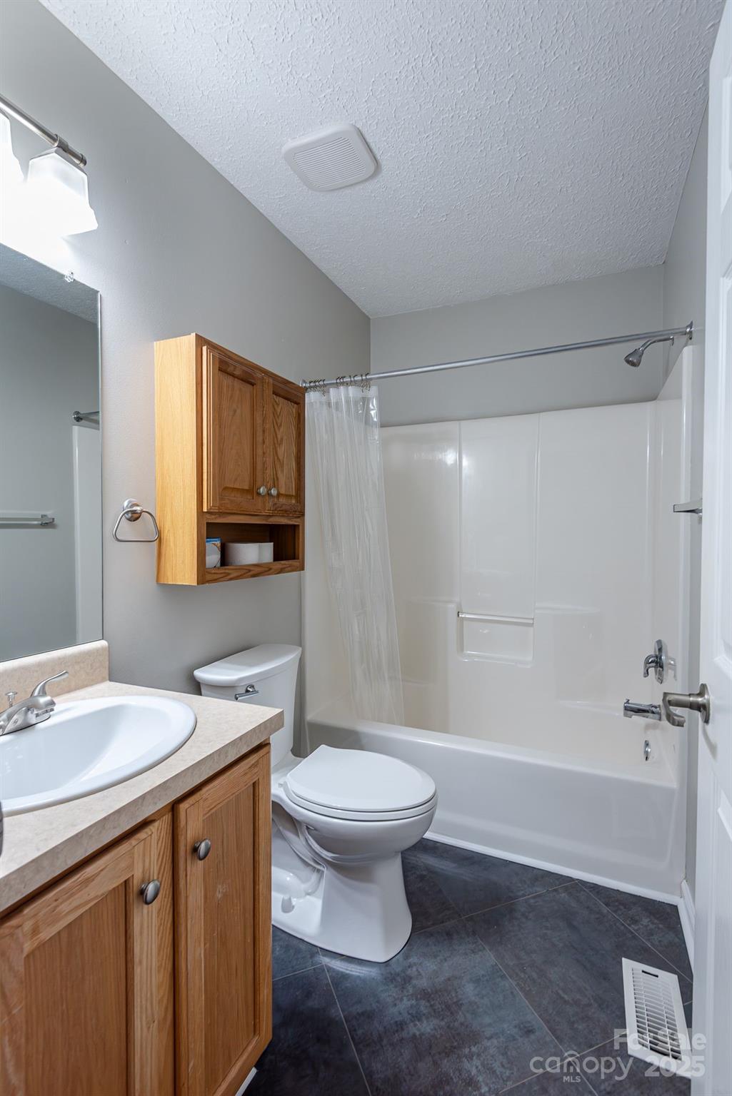263 Newberry Drive Fletcher, NC 28732 - Photo 11 of 29 a bathroom with a sink a toilet and a mirror