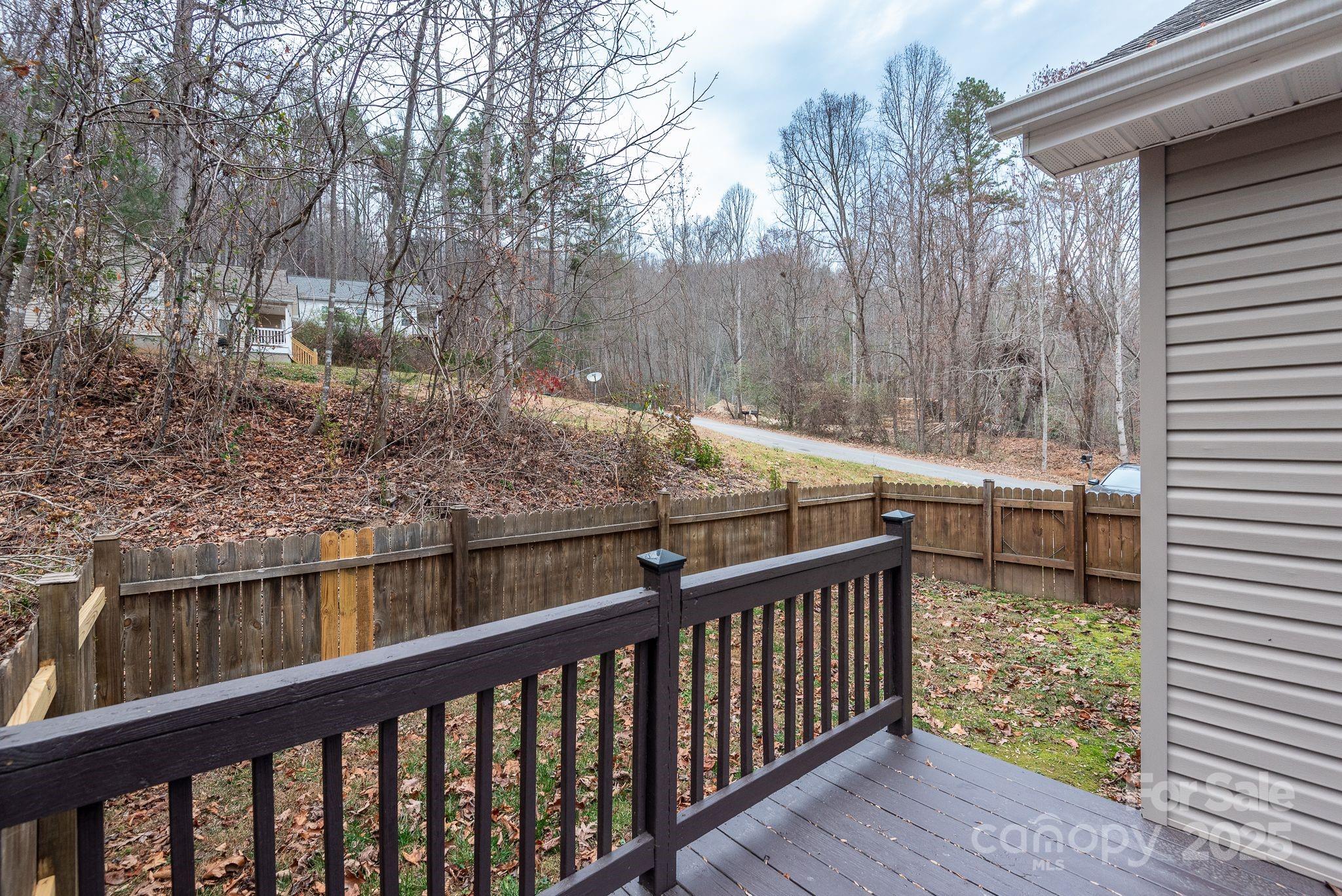263 Newberry Drive Fletcher, NC 28732 - Photo 18 of 29 a view of a balcony with wooden fence
