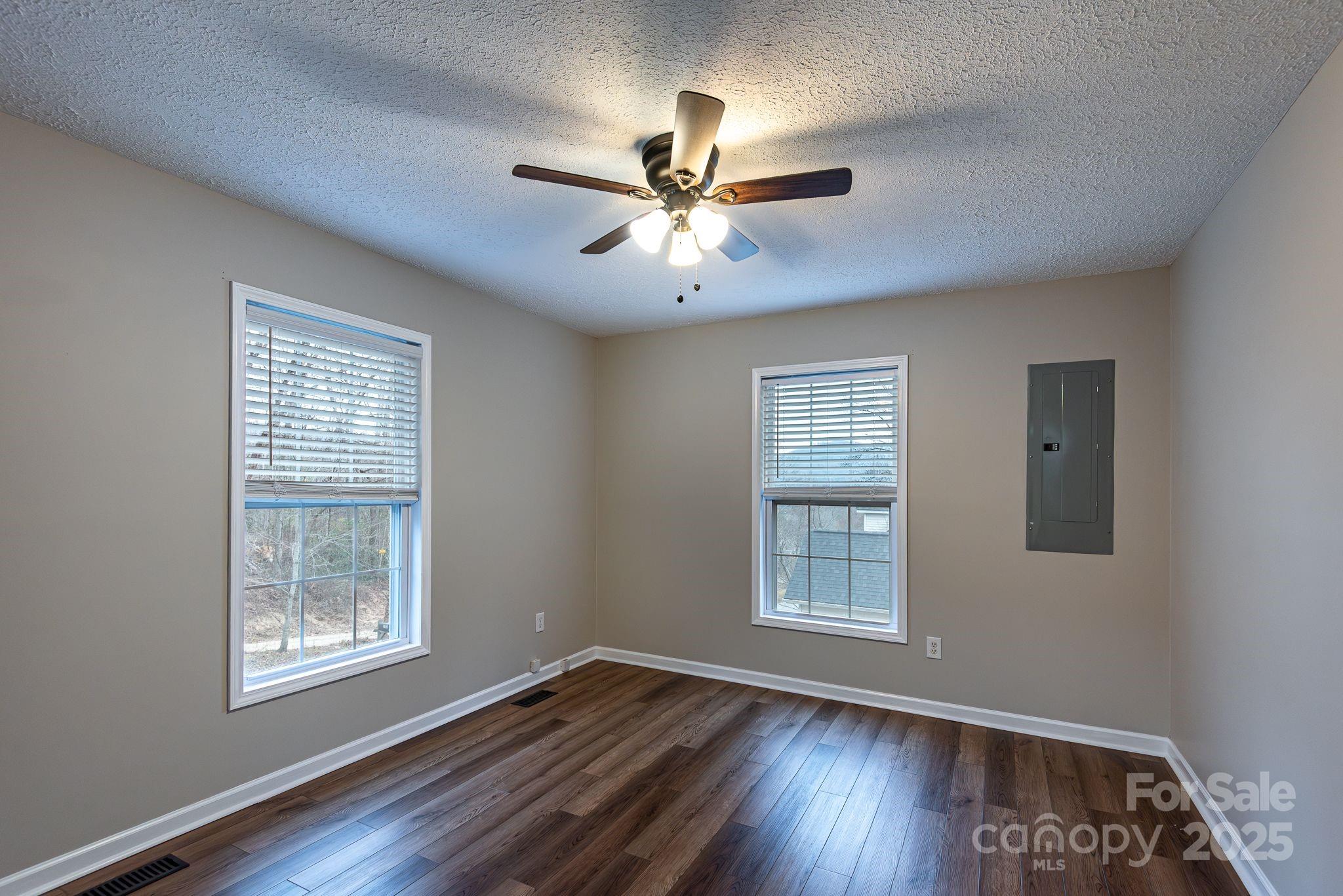 263 Newberry Drive Fletcher, NC 28732 - Photo 26 of 29 a view of an empty room with window and wooden floor