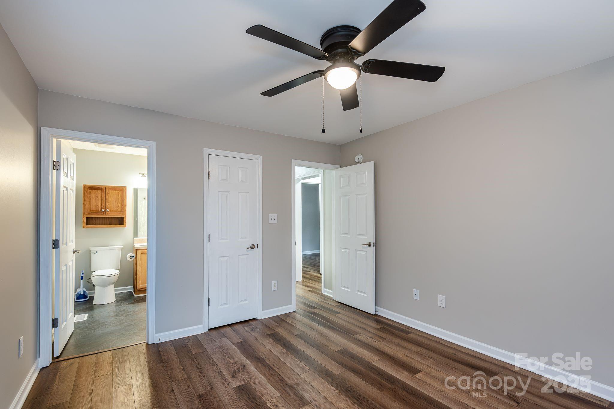263 Newberry Drive Fletcher, NC 28732 - Photo 4 of 29 wooden floor in an empty room with a bathroom