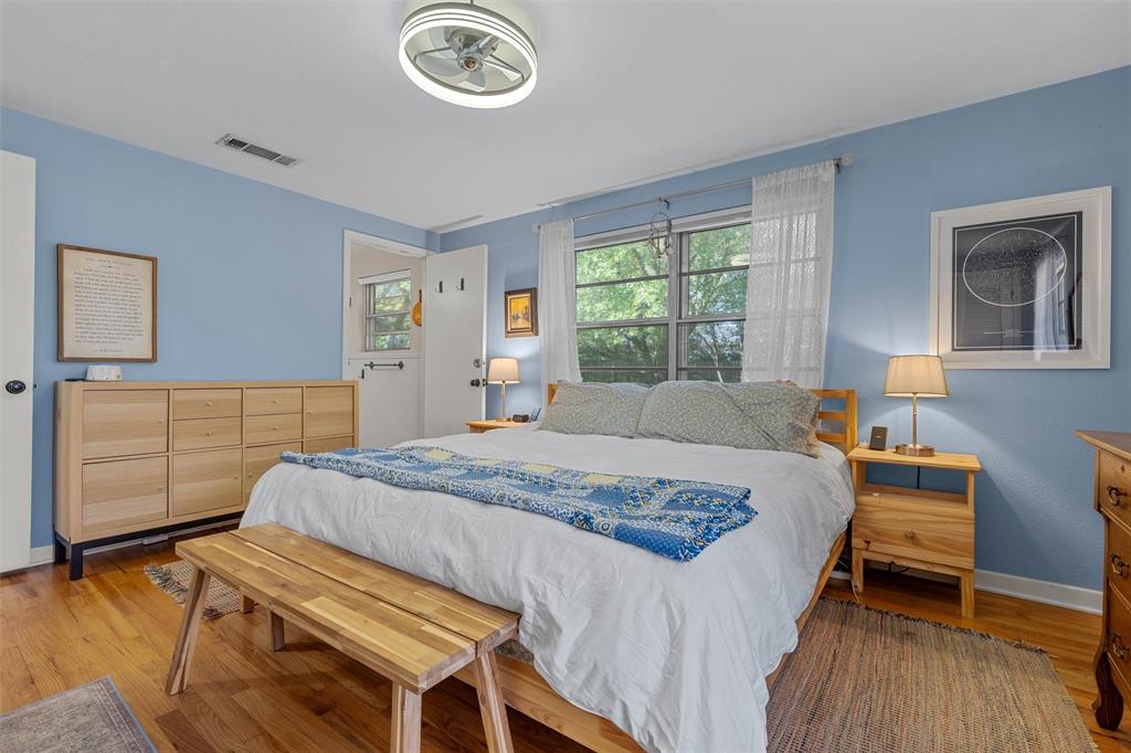 2216 Hermanson Drive Waco, TX 76710 - Photo 21 of 39 a bedroom with a bed and a chandelier