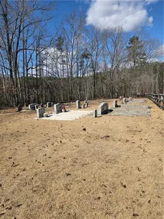 a view of a yard with snow on the road