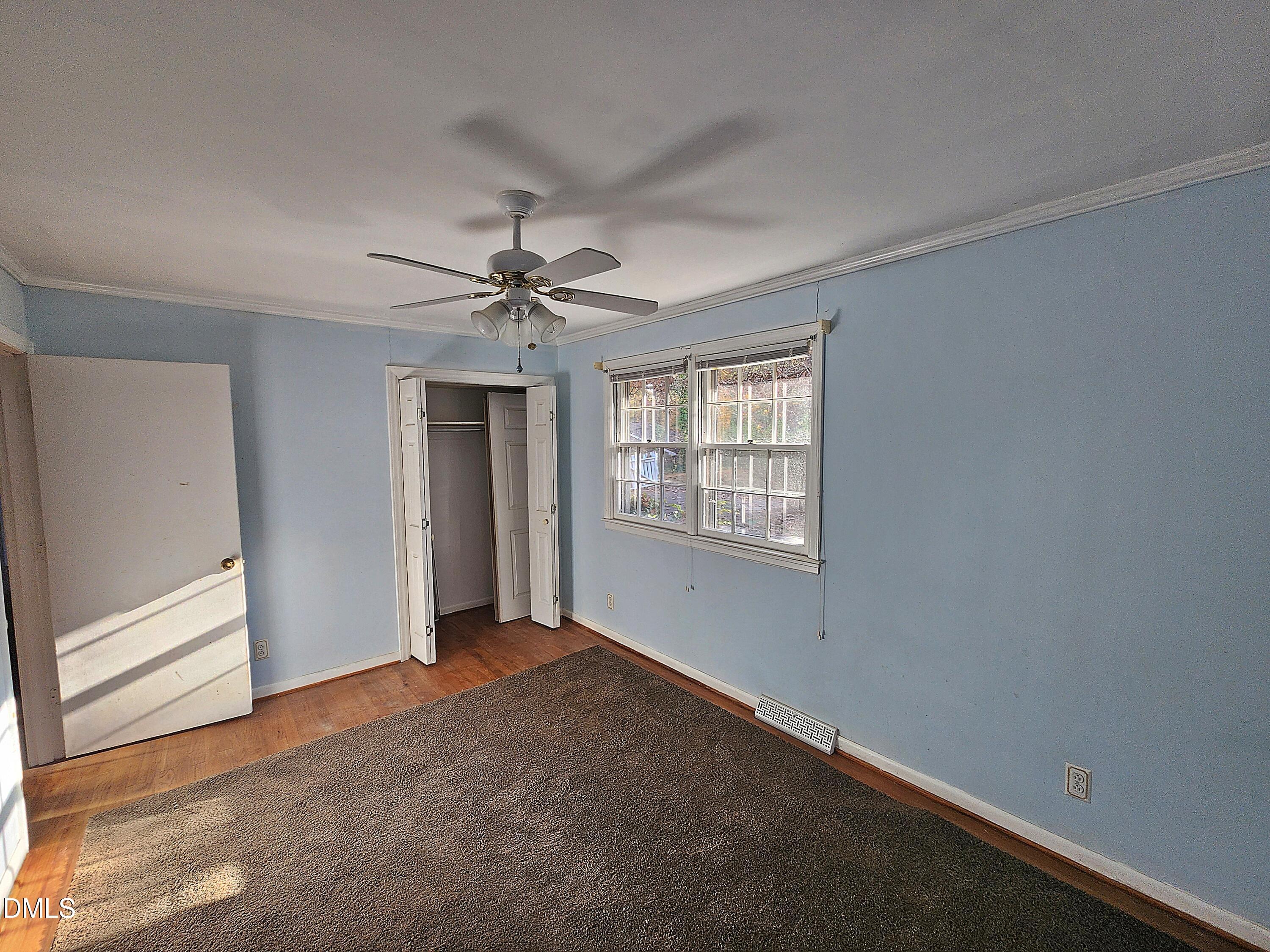 239 Hamilton Road Chapel Hill, NC 27517 - Photo 19 of 30 a view of a livingroom with a ceiling fan and window