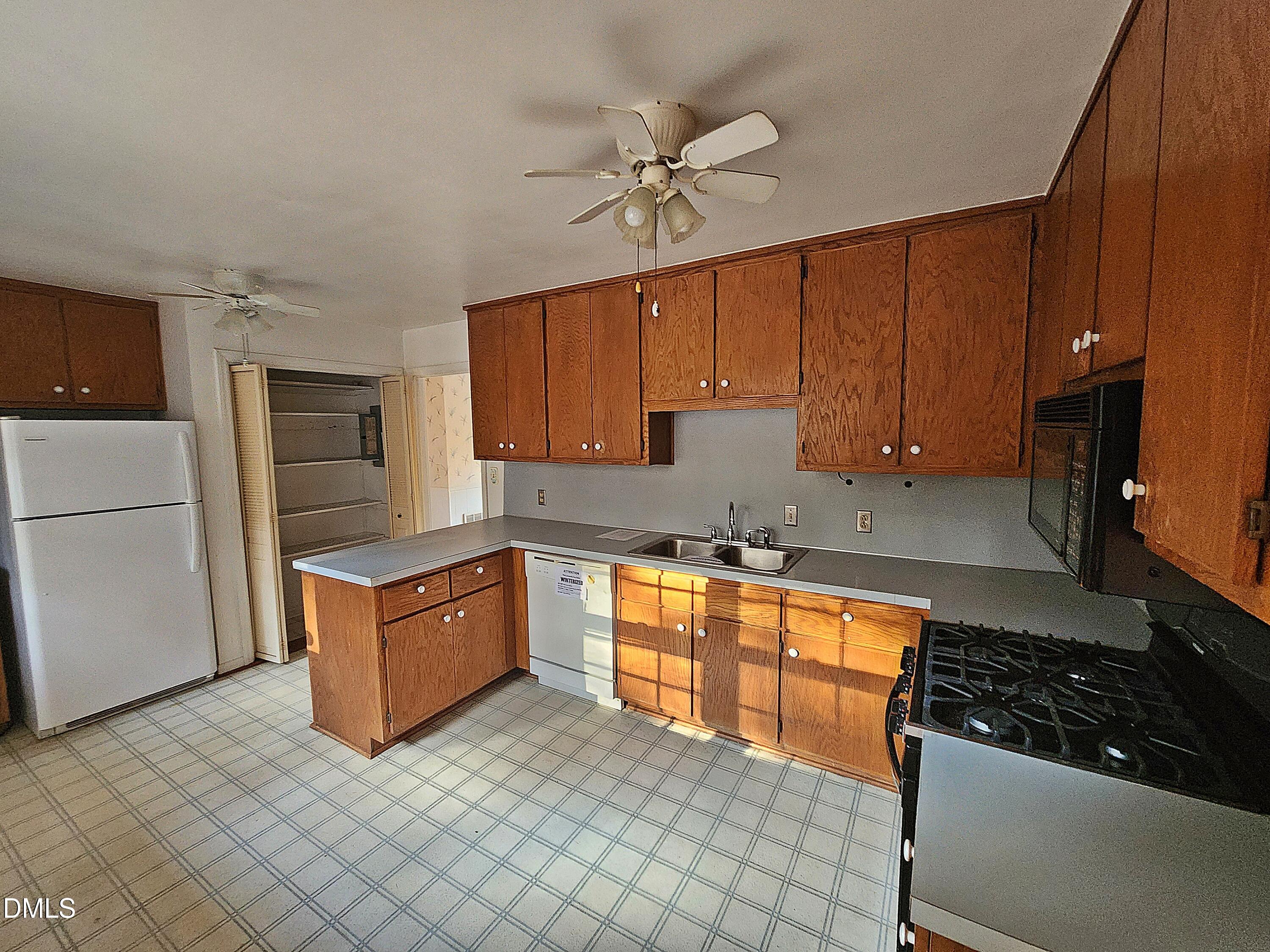 239 Hamilton Road Chapel Hill, NC 27517 - Photo 24 of 30 a kitchen with stainless steel appliances granite countertop a sink stove and refrigerator