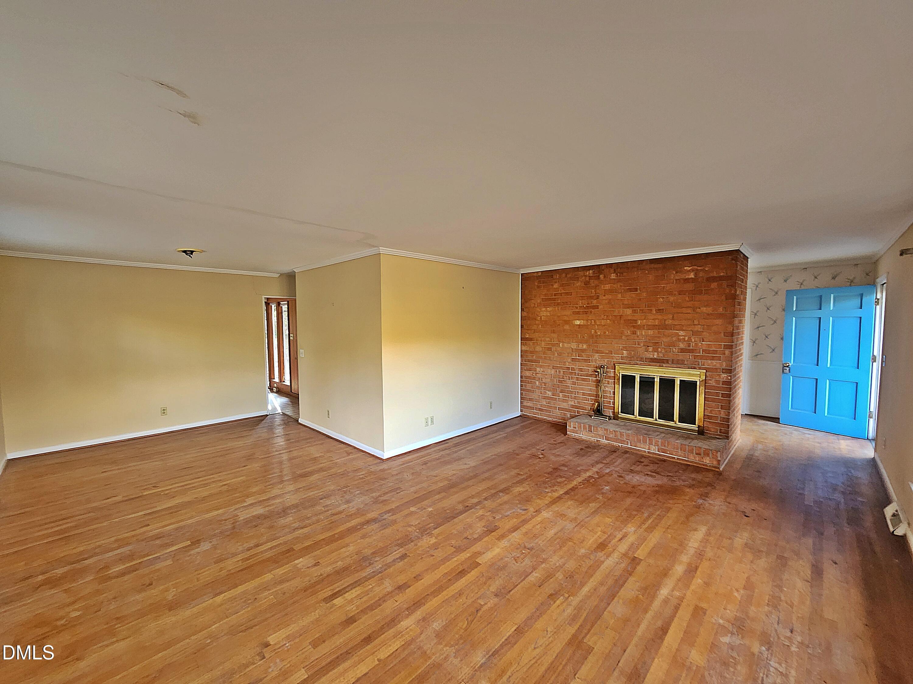 239 Hamilton Road Chapel Hill, NC 27517 - Photo 26 of 30 a view of an empty room with wooden floor and a window