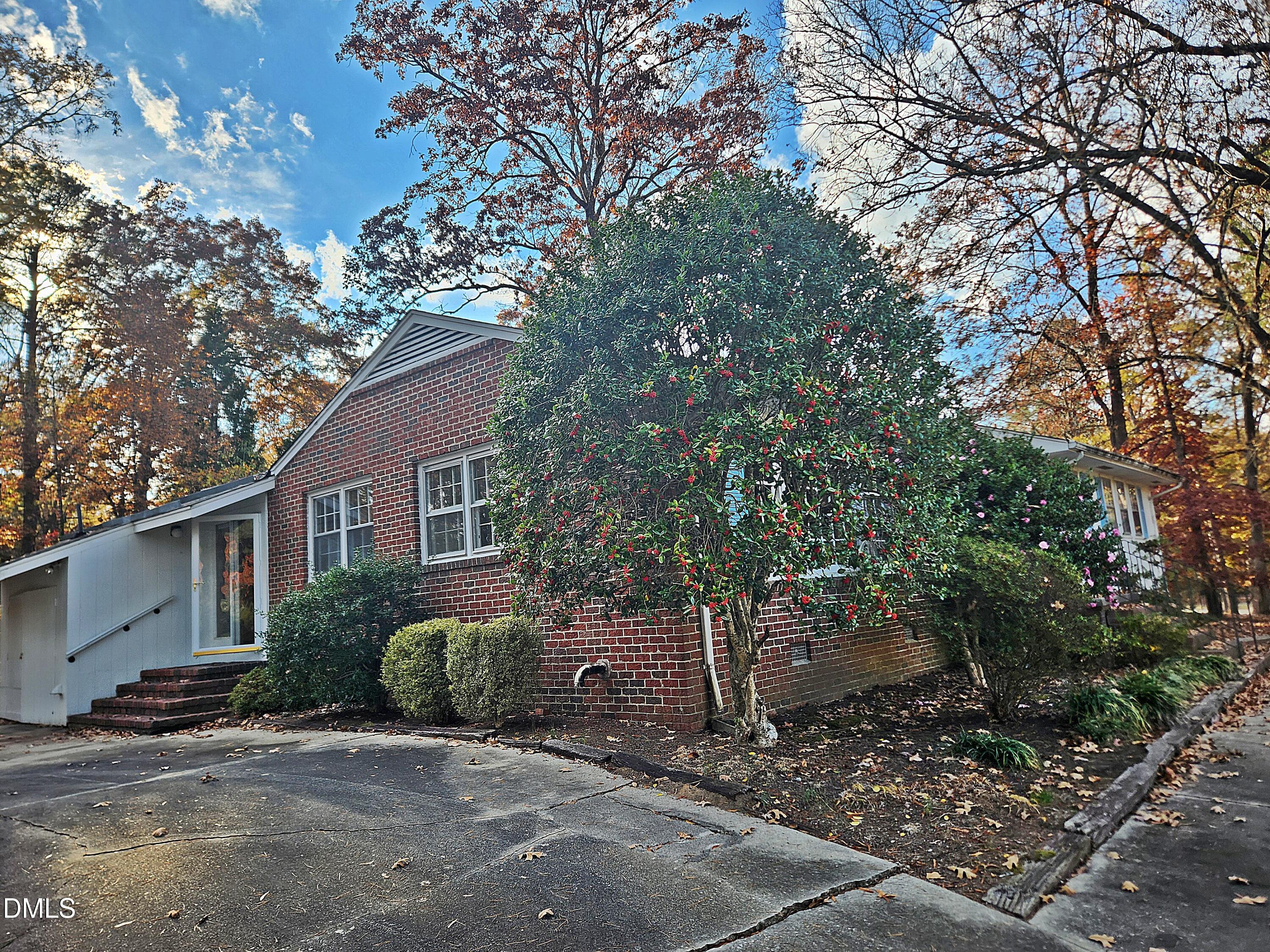 239 Hamilton Road Chapel Hill, NC 27517 - Photo 8 of 30 a view of a house with a tree in the background