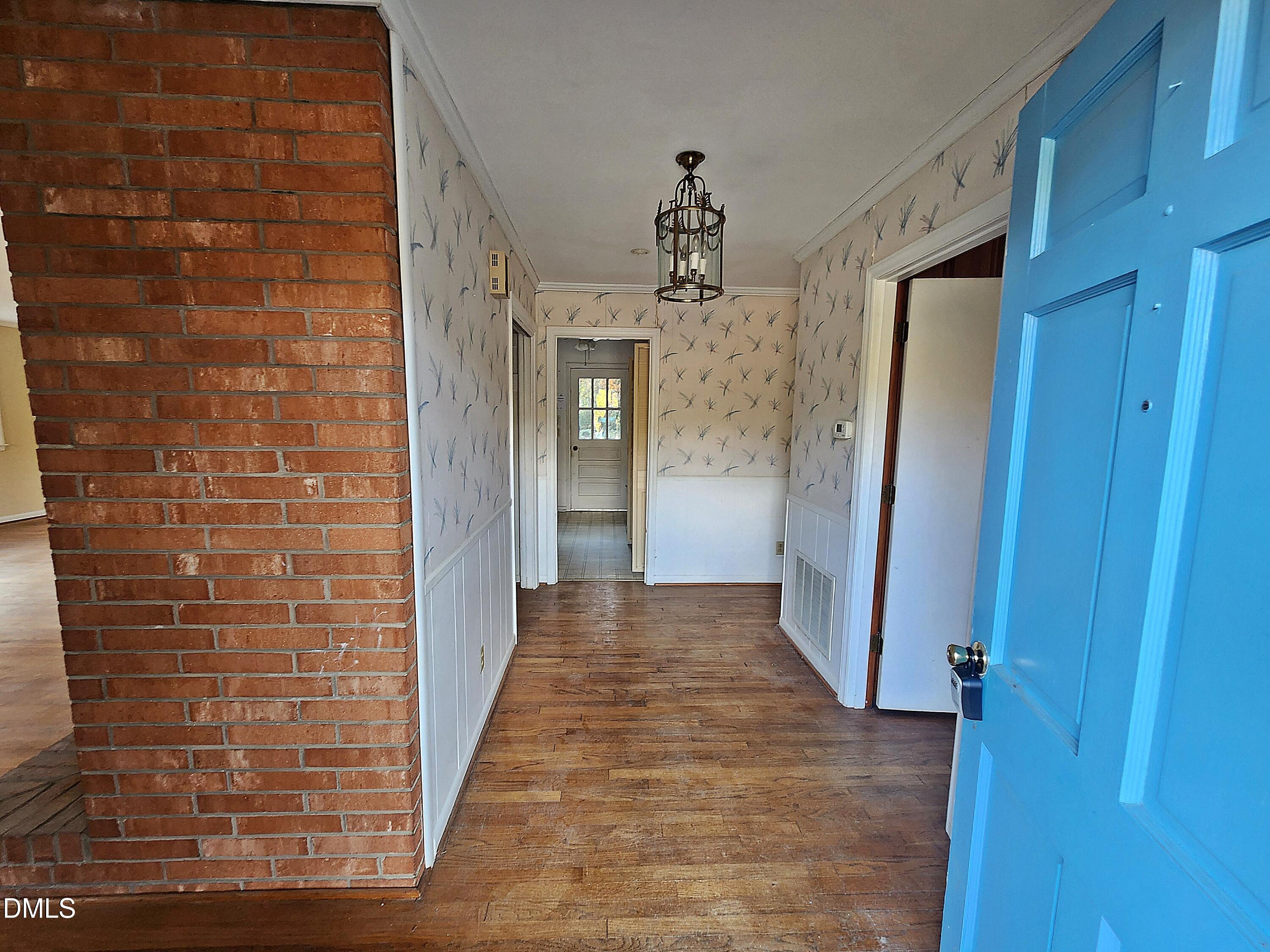 239 Hamilton Road Chapel Hill, NC 27517 - Photo 9 of 30 a view of a hallway with wooden floor and staircase